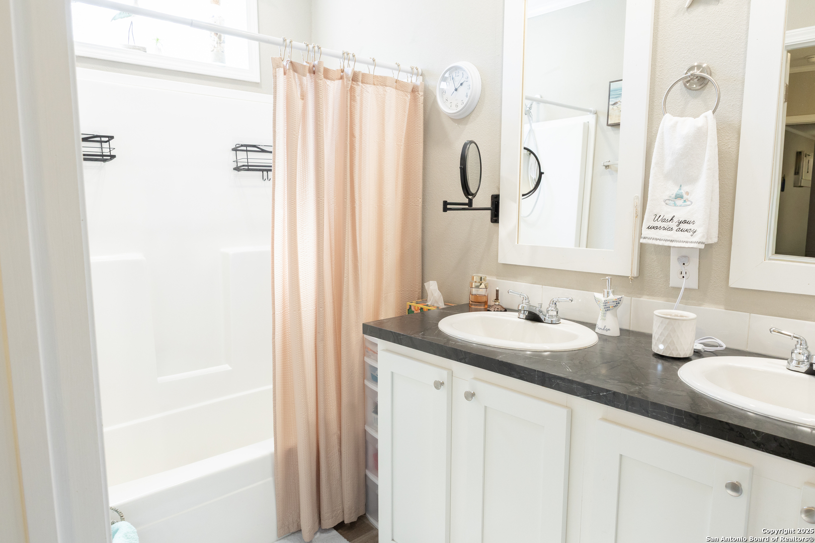 118 Flatrock Lane Junction, TX 76849 - Photo 9 of 18 a bathroom with a granite countertop sink and a mirror