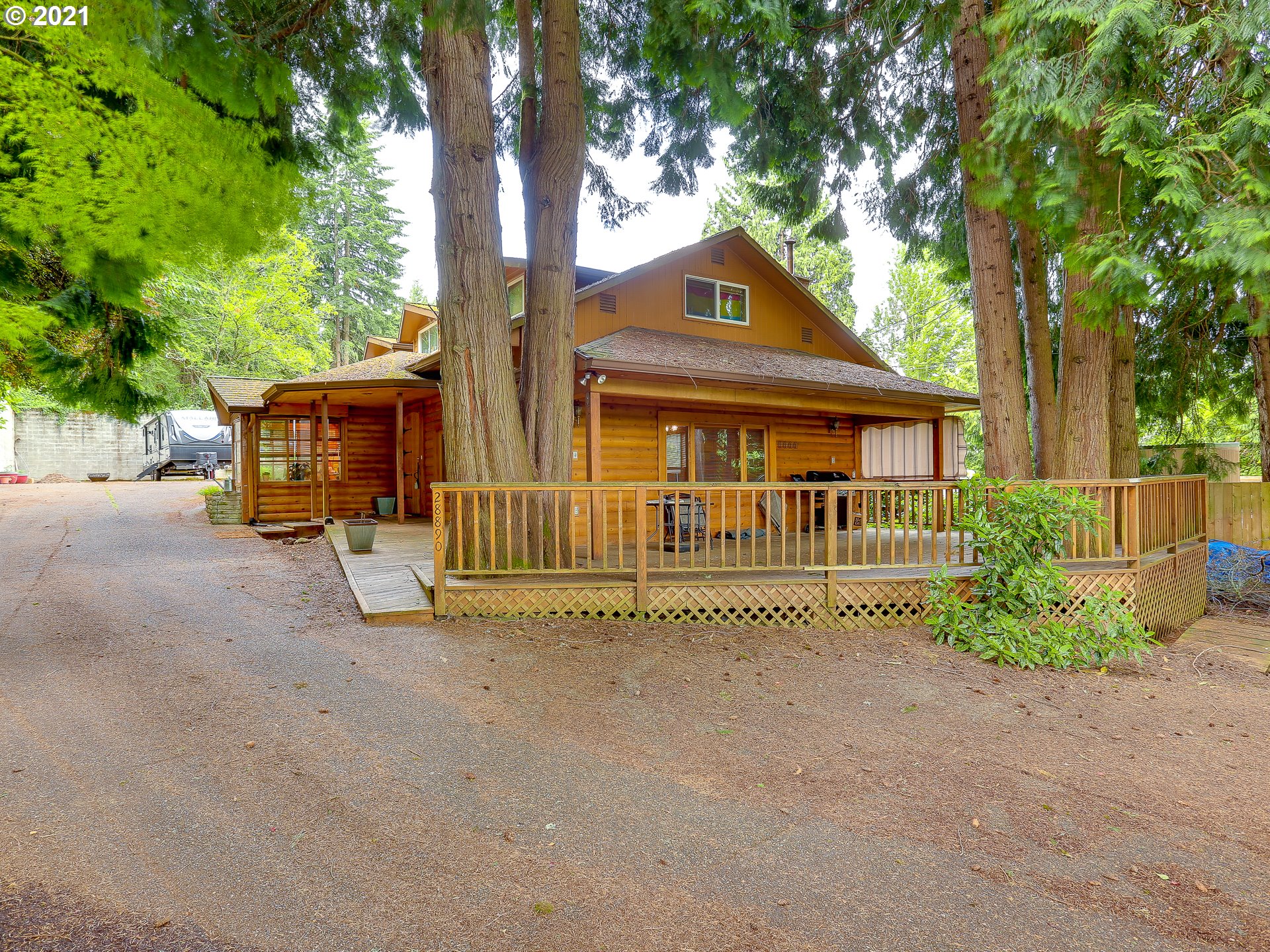 28890 Southeast Stone Road Boring, OR 97009 - Photo 1 of 26 a front view of a house with a garden and trees