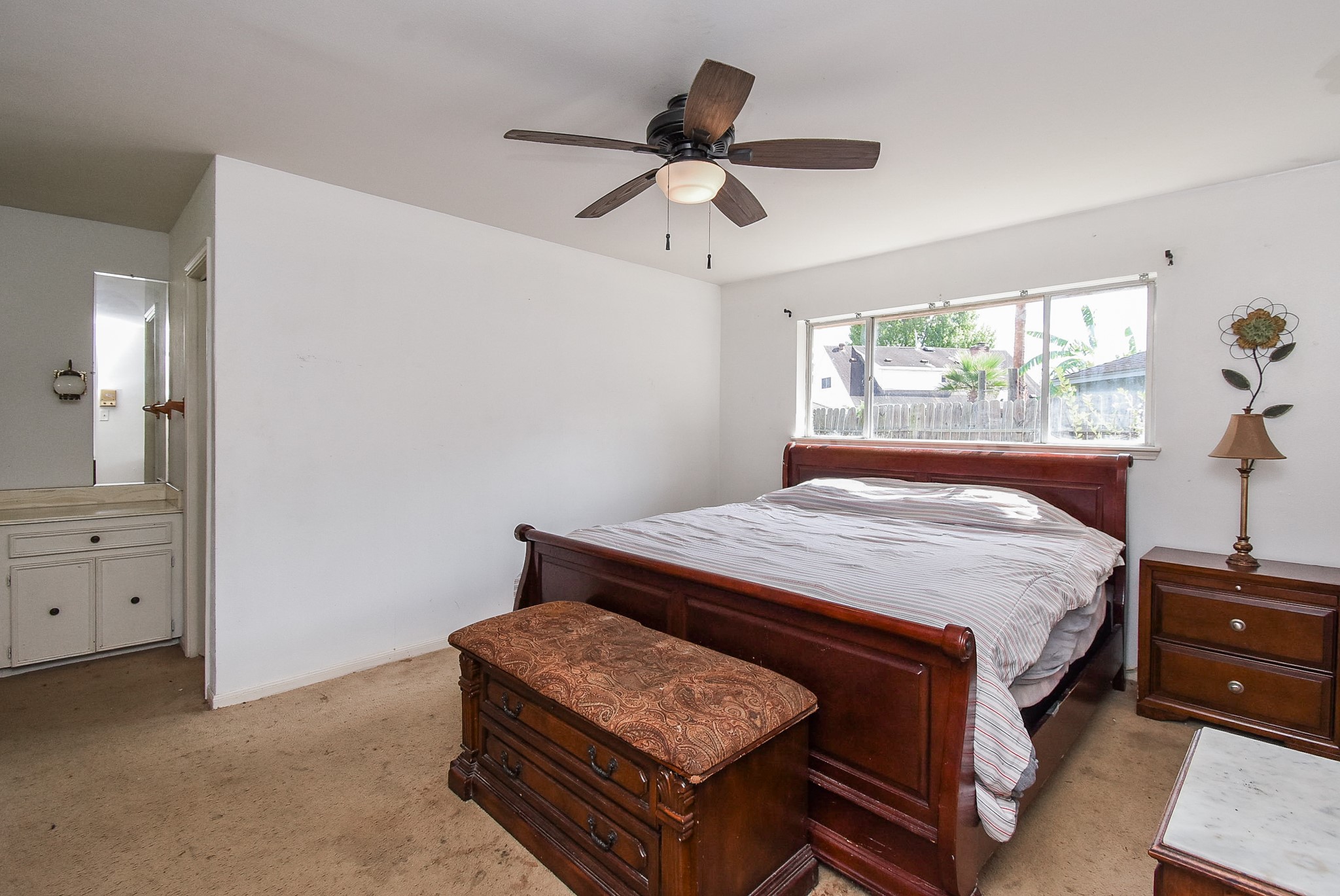 9703 Harrowgate Drive Houston, TX 77031 - Photo 22 of 32 Another view of the primary bedroom shows that the closet and sink are located on the left.
