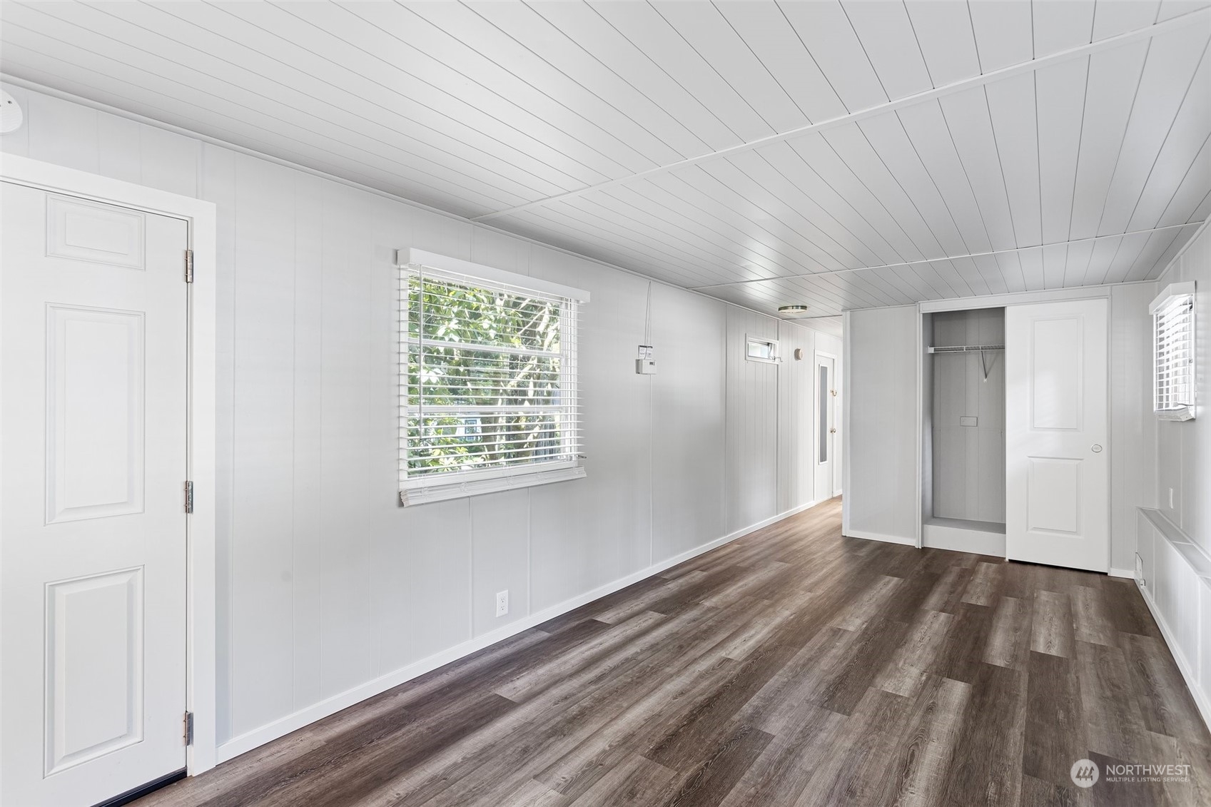 23800 Tiger Mountain Road Southeast, Unit 39 Issaquah, WA 98027 - Photo 8 of 15 a view of an empty room with wooden floor and a window