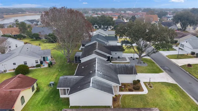 an aerial view of house with a yard