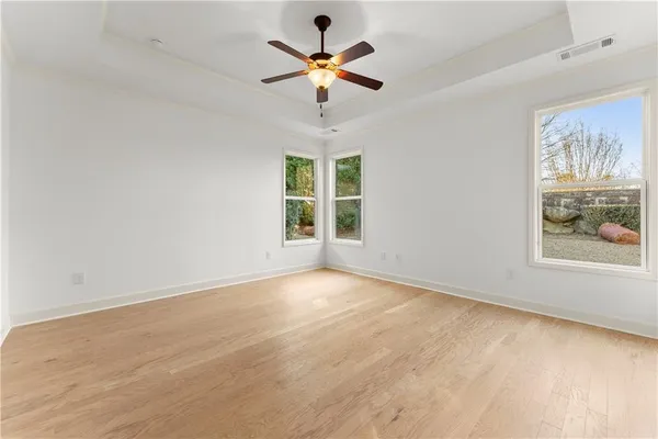a spacious bathroom with a double vanity sink and mirror