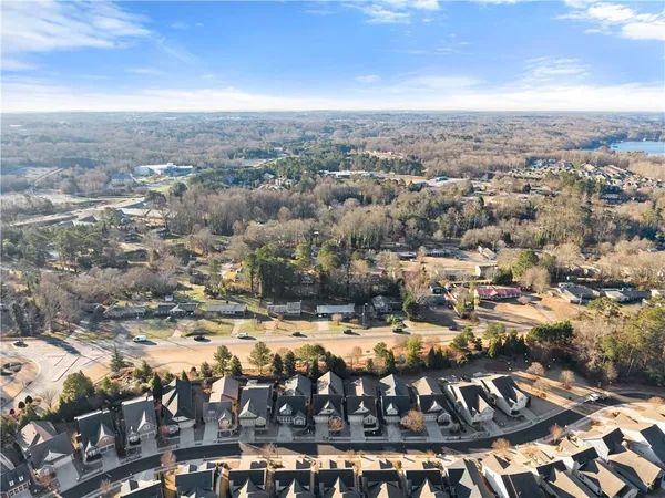 a view of a street with a bench in front of it