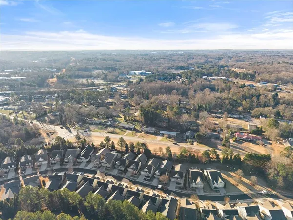 a front view of a house with swimming pool having outdoor seating