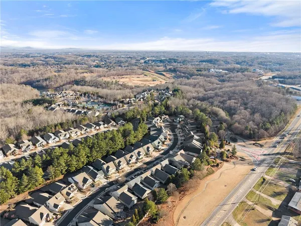 a view of backyard with seating area and trees