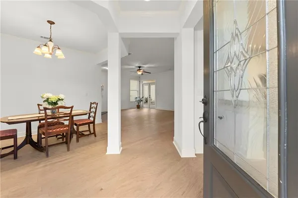 a dining room with furniture and window