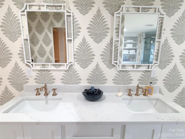 a bathroom with a tub shower and toilet