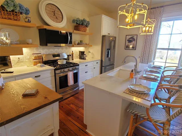 a room with a couch and a large window