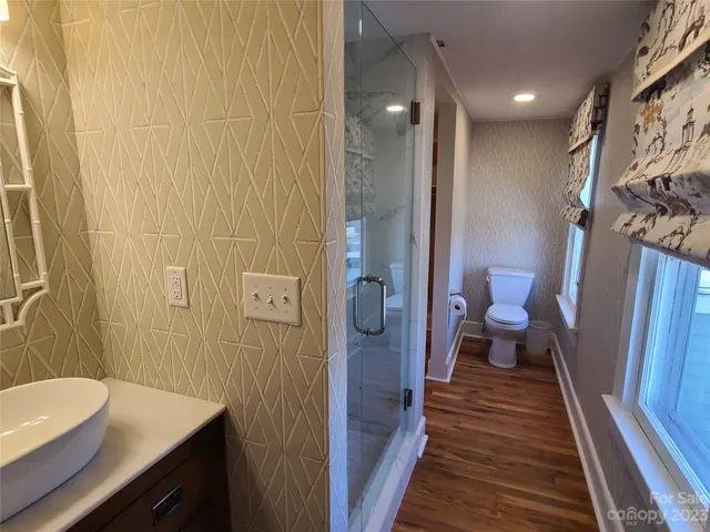 a white bath tub sitting next to a white toilet