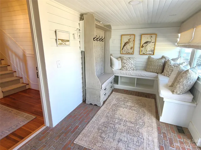 a view of a house with snow on the tree