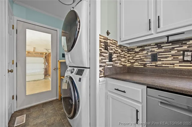 a close view of a sink and a utility room in a kitchen