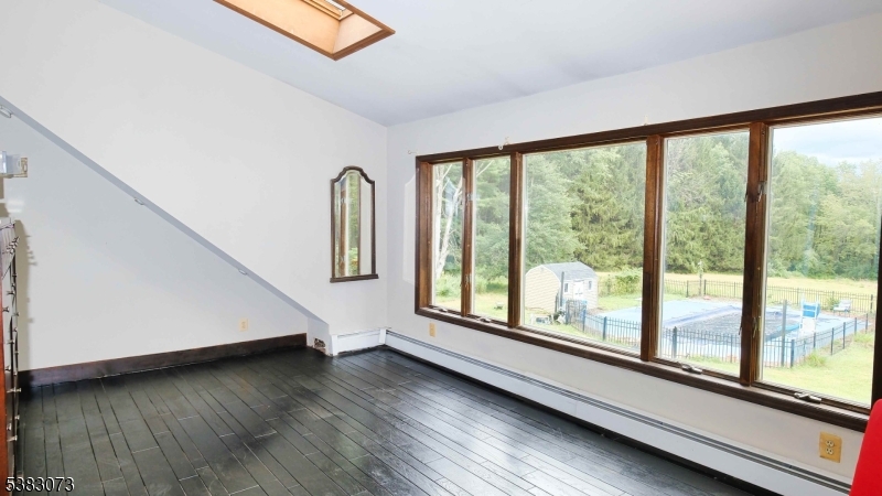 8 Ayers Road Montague, NJ 07827 - Photo 16 of 46 a view of a room with wooden floor and windows