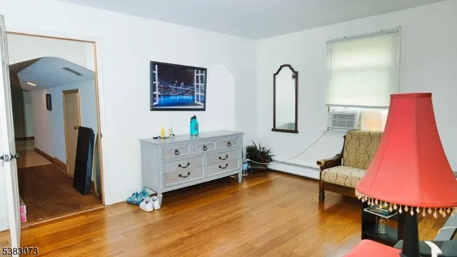 a kitchen with stainless steel appliances a stove a refrigerator a sink a oven and white cabinets