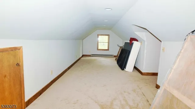 a room with a dresser and a window