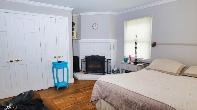 8 Ayers Road Montague, NJ 07827 - Photo 39 of 46 a bedroom with bed and a fireplace
