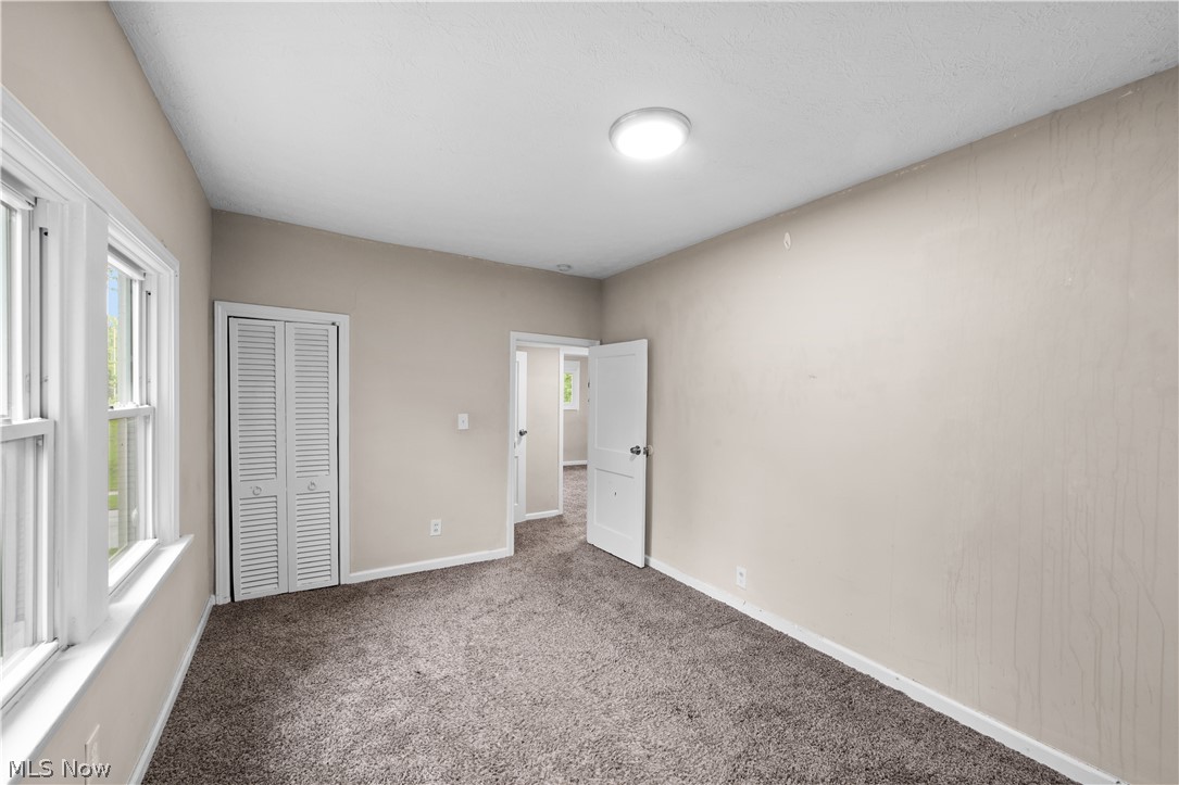 1062 Yellowstone Road Cleveland Heights, OH 44121 - Photo 22 of 29 Unfurnished bedroom featuring a closet and carpet floors