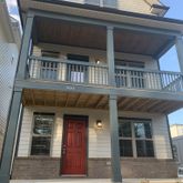 a view of a house with a door and a window