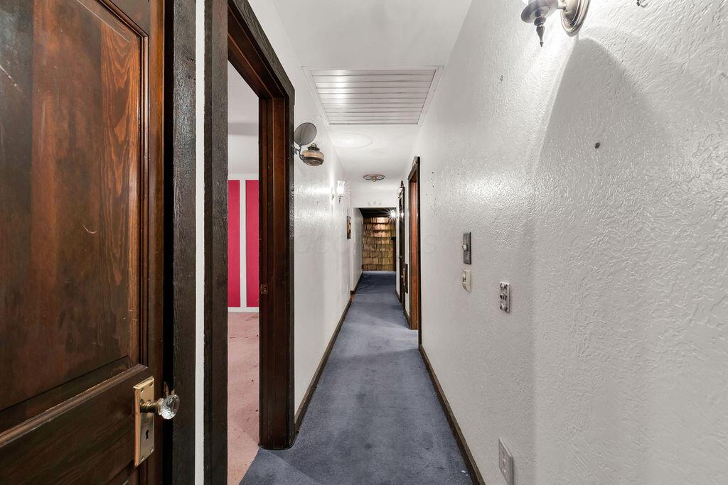 4409 Newton Road Northeast Newark, OH 43055 - Photo 31 of 87 • Blue carpet • Venetian plaster walls • Whole house attic fan • Wall light • Linen closet