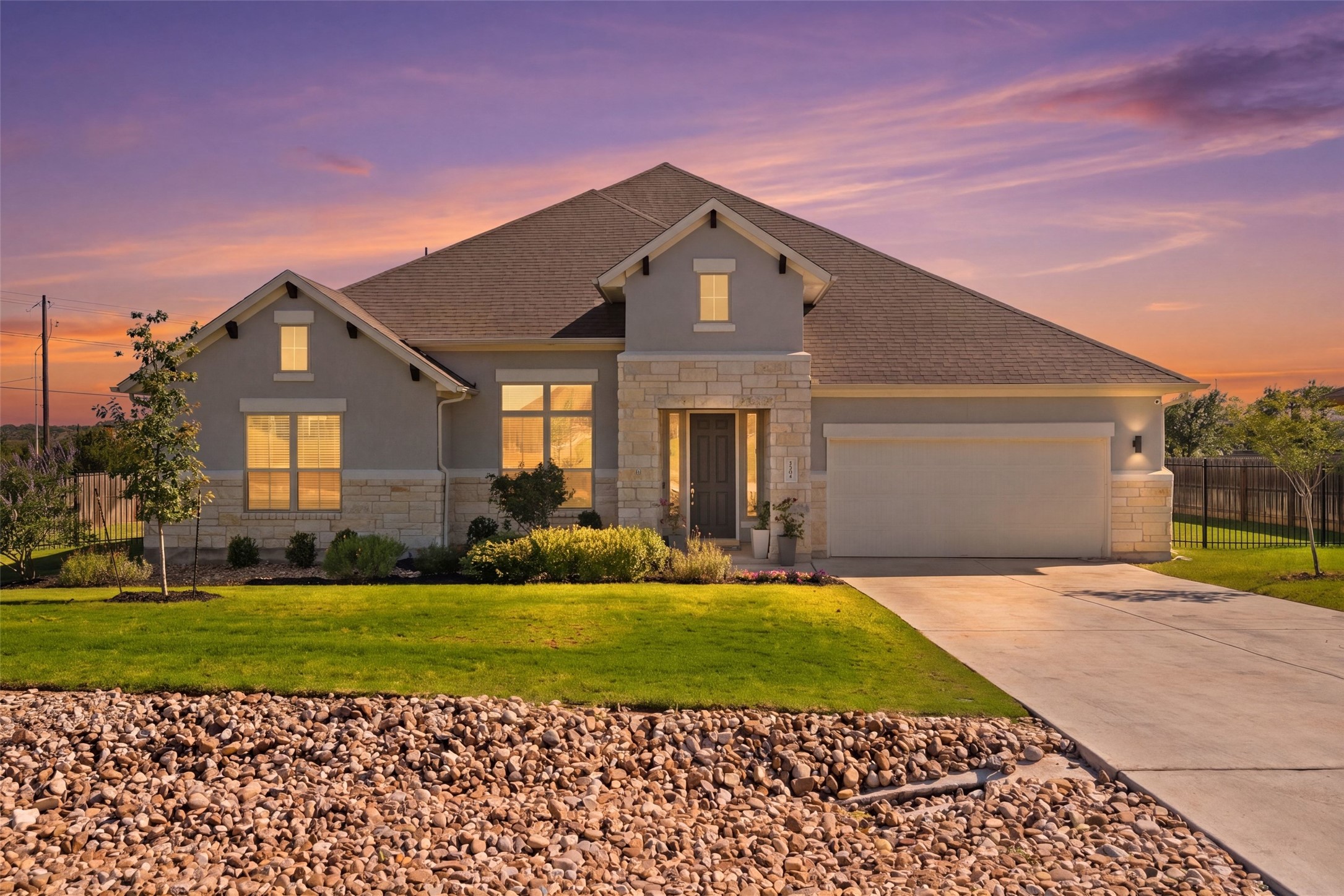 162 Lunar Loop Austin, TX 78737 - Photo 2 of 40 a front view of a house with a yard