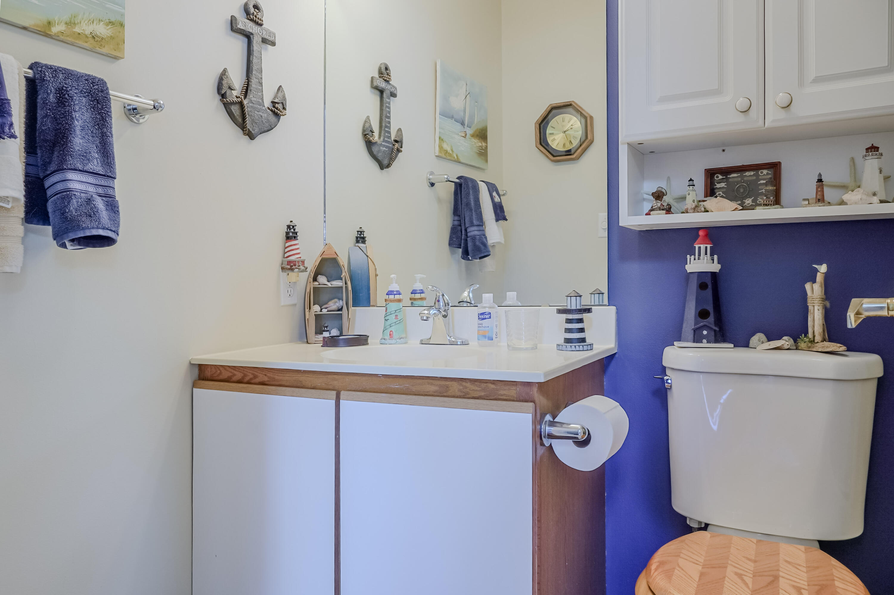 5065 Spinnaker Lane, Unit D Crown Point, IN 46307 - Photo 23 of 42 a bathroom with a sink a mirror and toilet