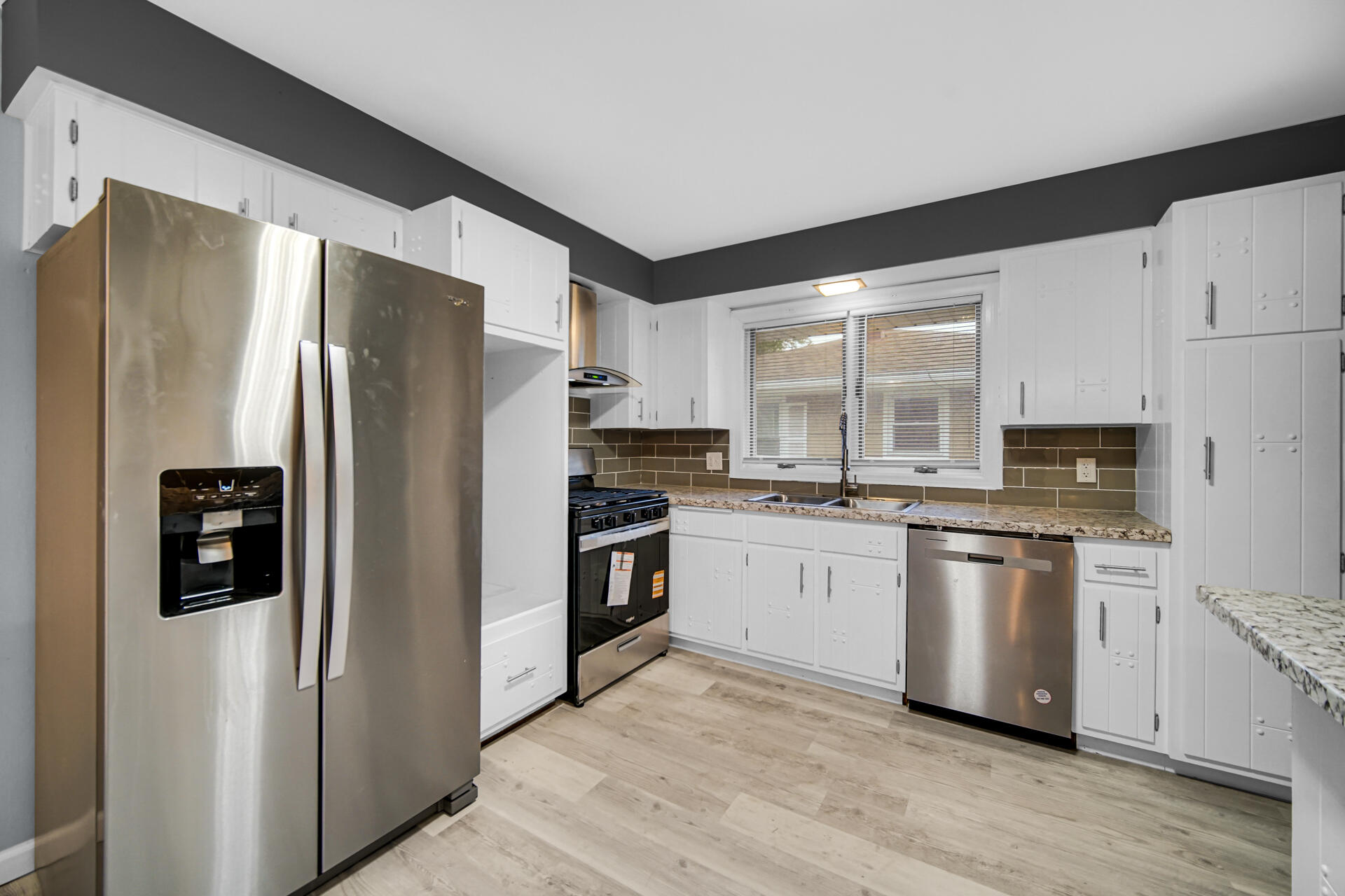 212 Timrick Drive Munster, IN 46321 - Photo 2 of 46 a kitchen with stainless steel appliances a refrigerator sink and microwave