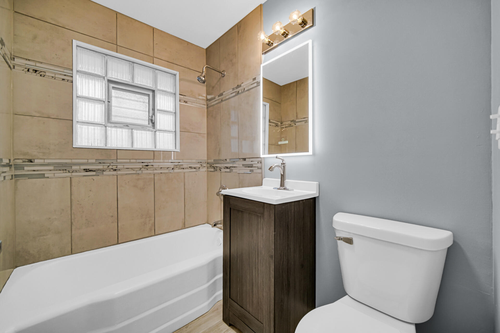 212 Timrick Drive Munster, IN 46321 - Photo 28 of 46 a bathroom with a sink toilet and shower