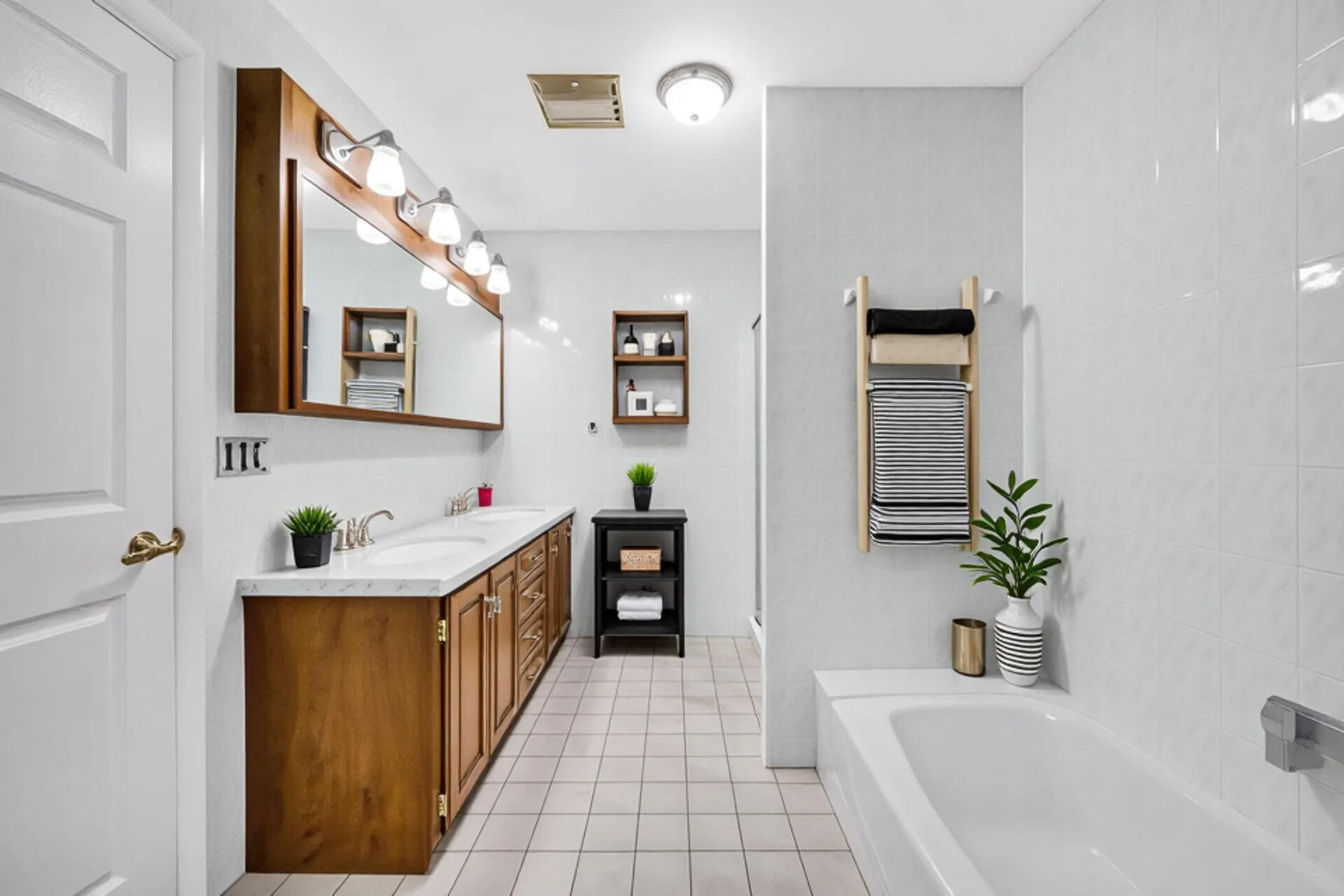 212 Timrick Drive Munster, IN 46321 - Photo 31 of 46 a bathroom with a sink a bathtub and a mirror