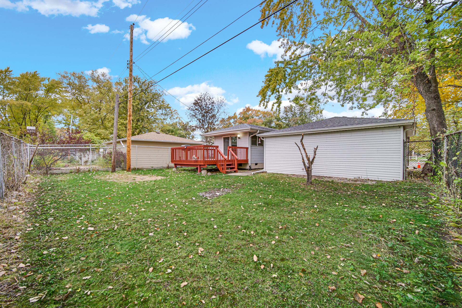 212 Timrick Drive Munster, IN 46321 - Photo 45 of 46 a view of a house with backyard sitting area and garden