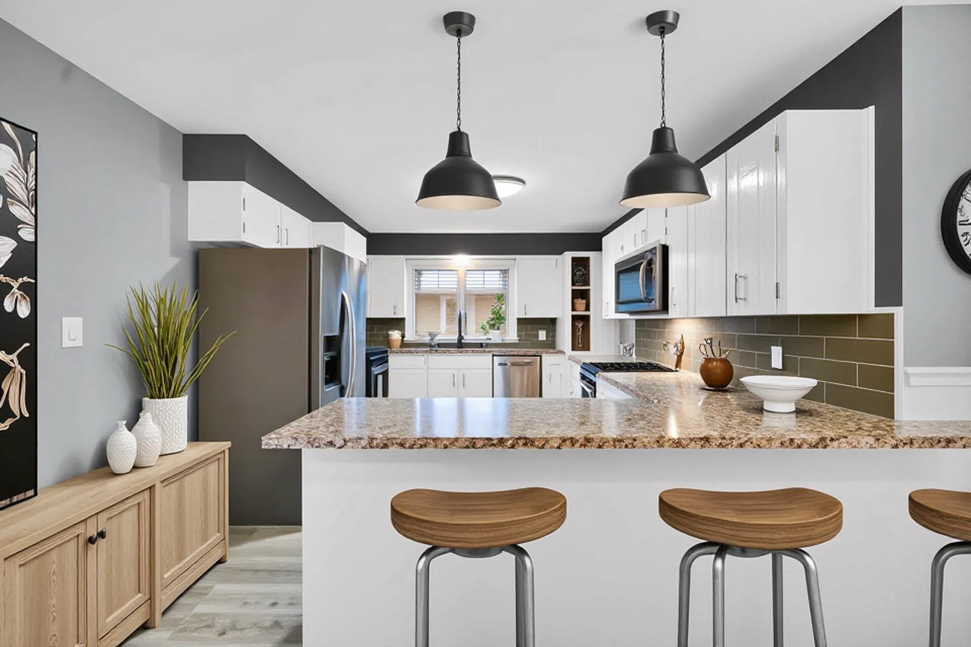 212 Timrick Drive Munster, IN 46321 - Photo 5 of 46 a kitchen with stainless steel appliances granite countertop a sink a refrigerator and a white cabinets