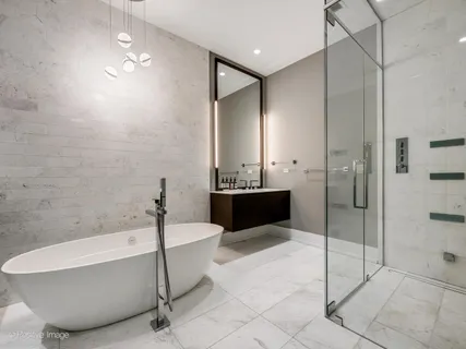 a bathroom with a bathtub and a shower