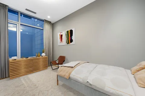 a bedroom with a bed and a cabinets