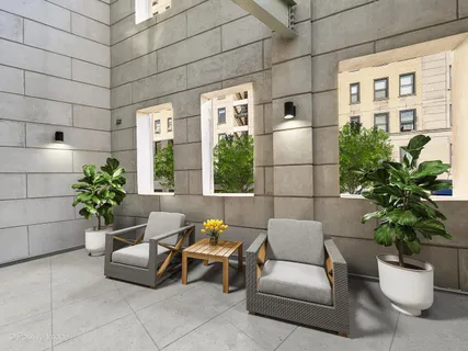 a living room with furniture and flowers