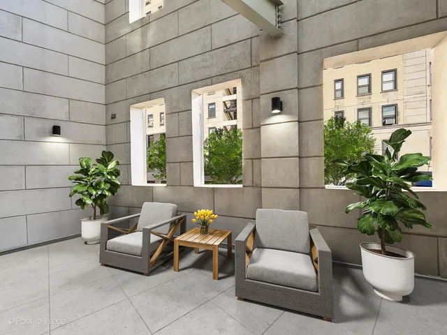 a living room with furniture and flowers