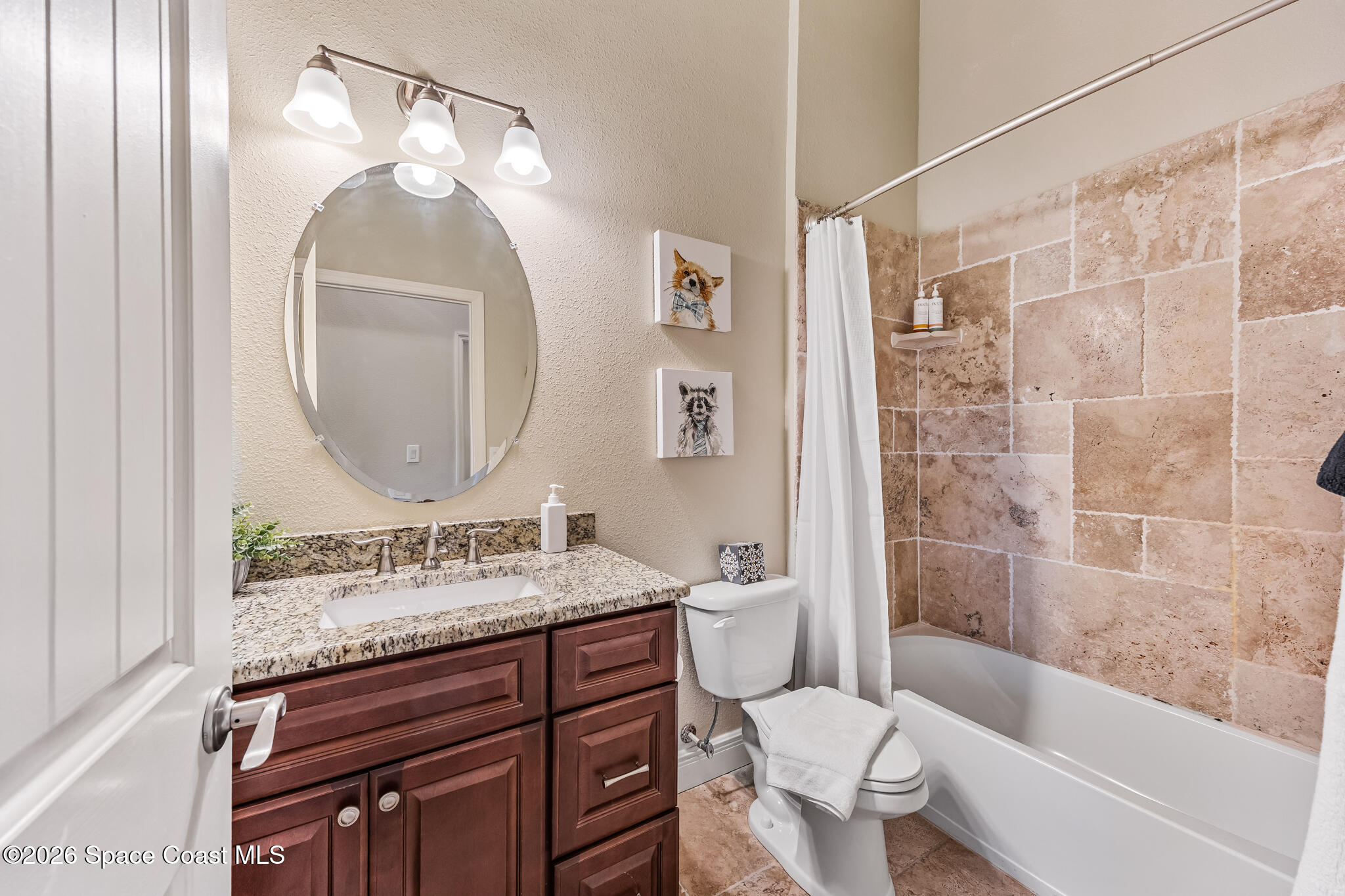 2709 Cutlass Point Lane, Unit 102 Merritt Island, FL 32953 - Photo 18 of 37 a bathroom with a sink a toilet and shower