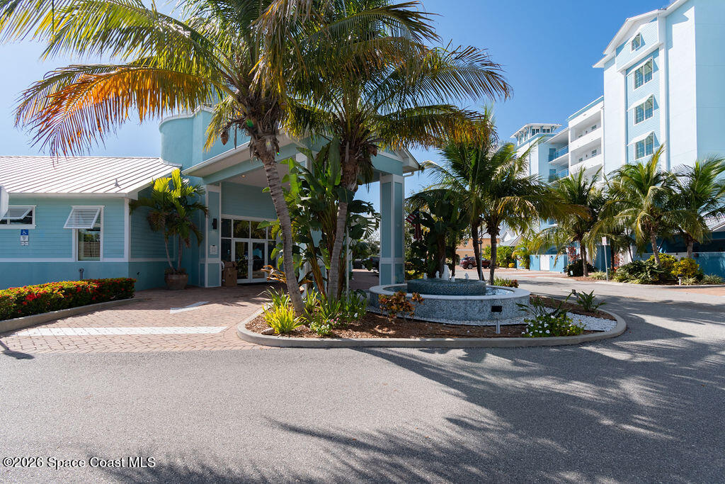 2709 Cutlass Point Lane, Unit 102 Merritt Island, FL 32953 - Photo 29 of 37 a palm tree sitting in front of a building