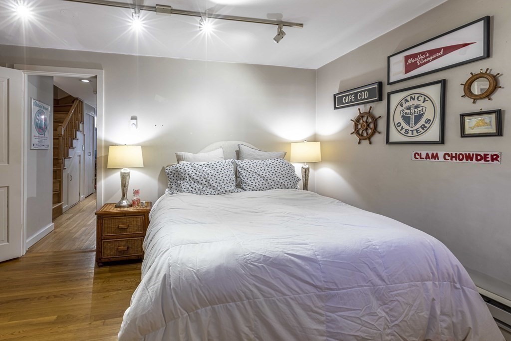 54 Appleton Street, Unit 1 Boston, MA 02116 - Photo 15 of 28 a bedroom with a bed and a lamp on table