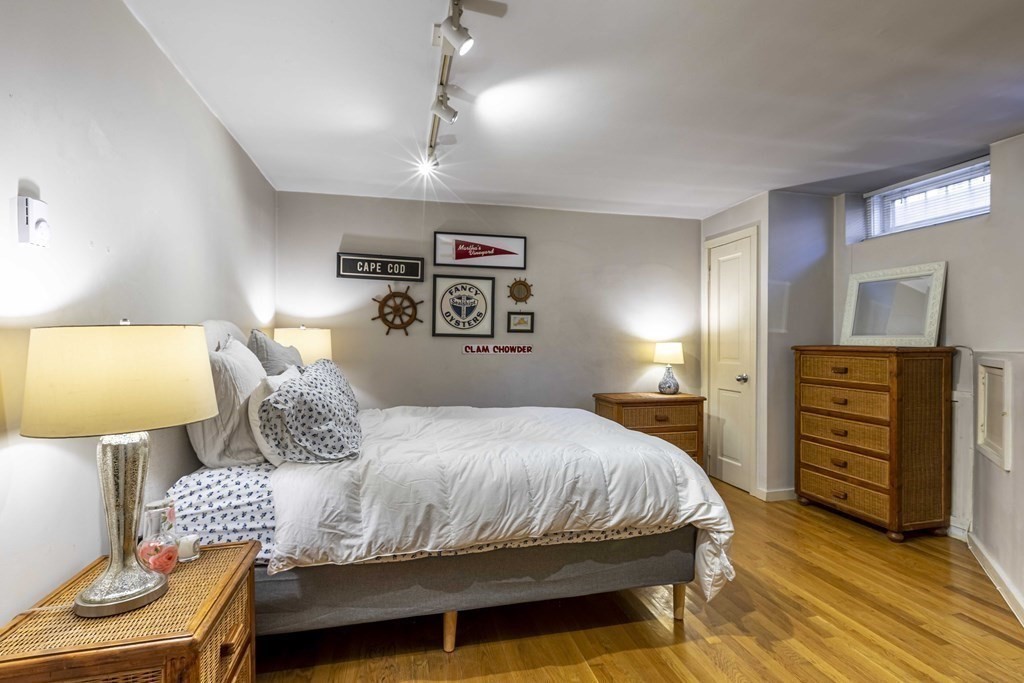 54 Appleton Street, Unit 1 Boston, MA 02116 - Photo 17 of 28 a bedroom with a bed and wooden floor