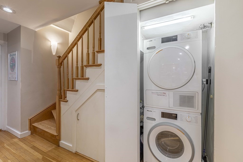 54 Appleton Street, Unit 1 Boston, MA 02116 - Photo 20 of 28 a view of a hallway with washer and dryer