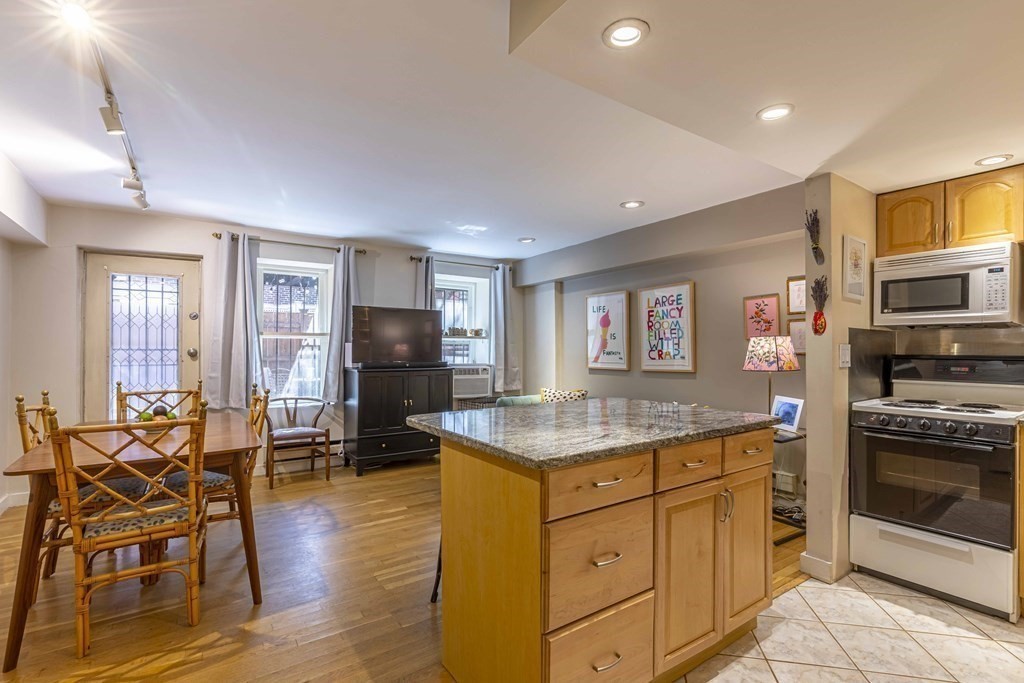 54 Appleton Street, Unit 1 Boston, MA 02116 - Photo 2 of 28 a kitchen that has a table and chairs in it
