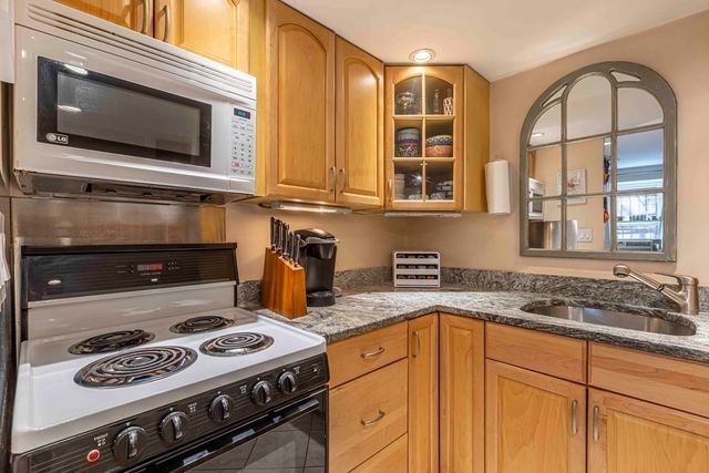 a kitchen with a stove and a microwave