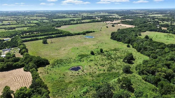 an aerial view of lake residential houses with outdoor space and swimming pool