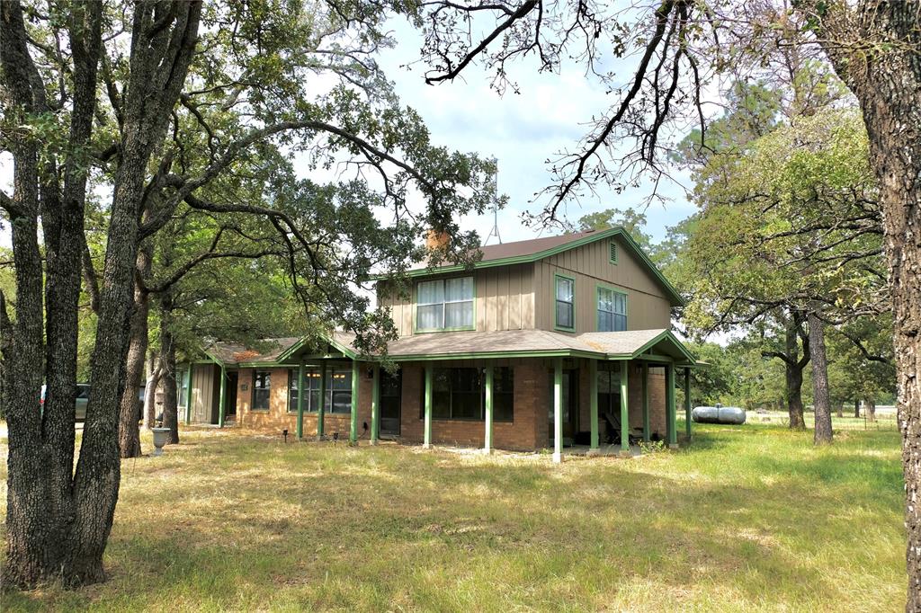 1860 Ranger Highway Weatherford, TX 76088 - Photo 1 of 1 a view of an house with backyard space and balcony
