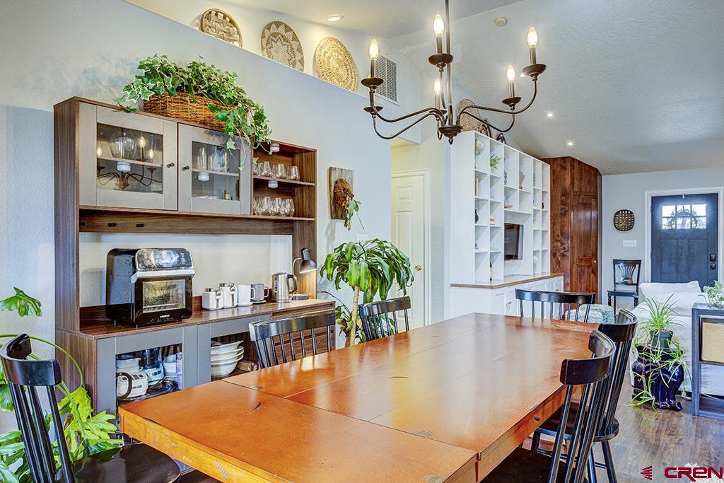 407 Colorado Street Cortez, CO 81321 - Photo 14 of 35 a dining room with furniture and a floor to ceiling window