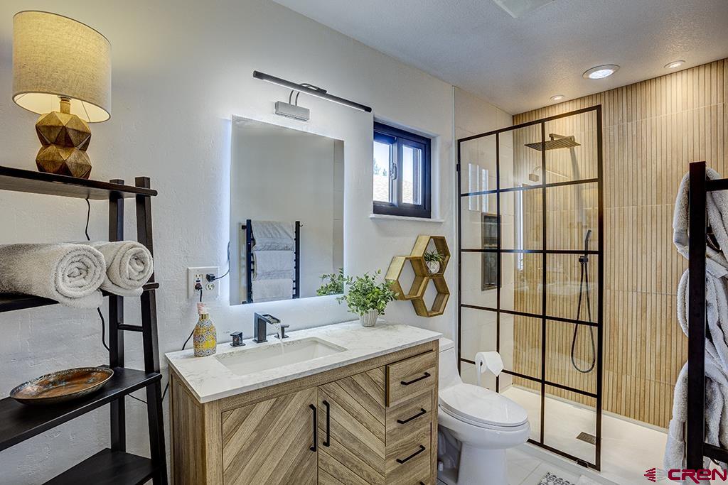 407 Colorado Street Cortez, CO 81321 - Photo 20 of 35 a bathroom with a sink toilet and shower