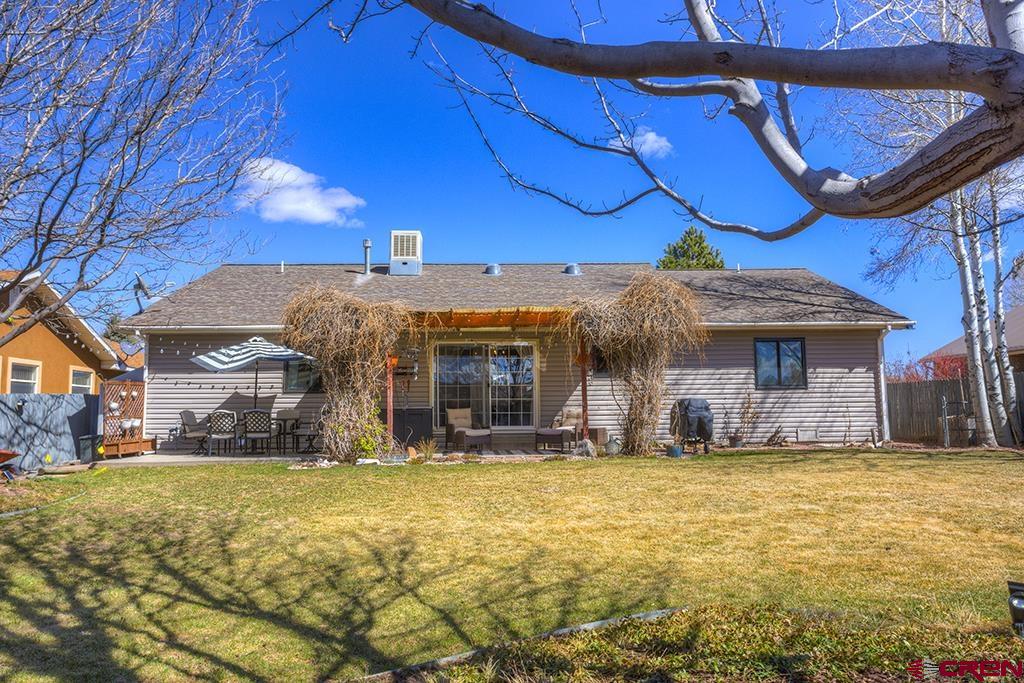 407 Colorado Street Cortez, CO 81321 - Photo 28 of 35 a view of a house with a yard