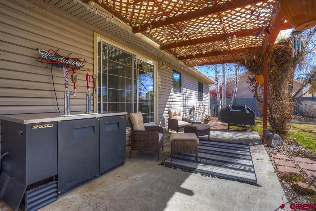 407 Colorado Street Cortez, CO 81321 - Photo 30 of 35 a backyard of a house with seating space