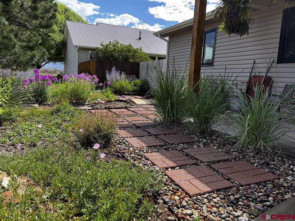 407 Colorado Street Cortez, CO 81321 - Photo 33 of 35 a view of a backyard with potted plants