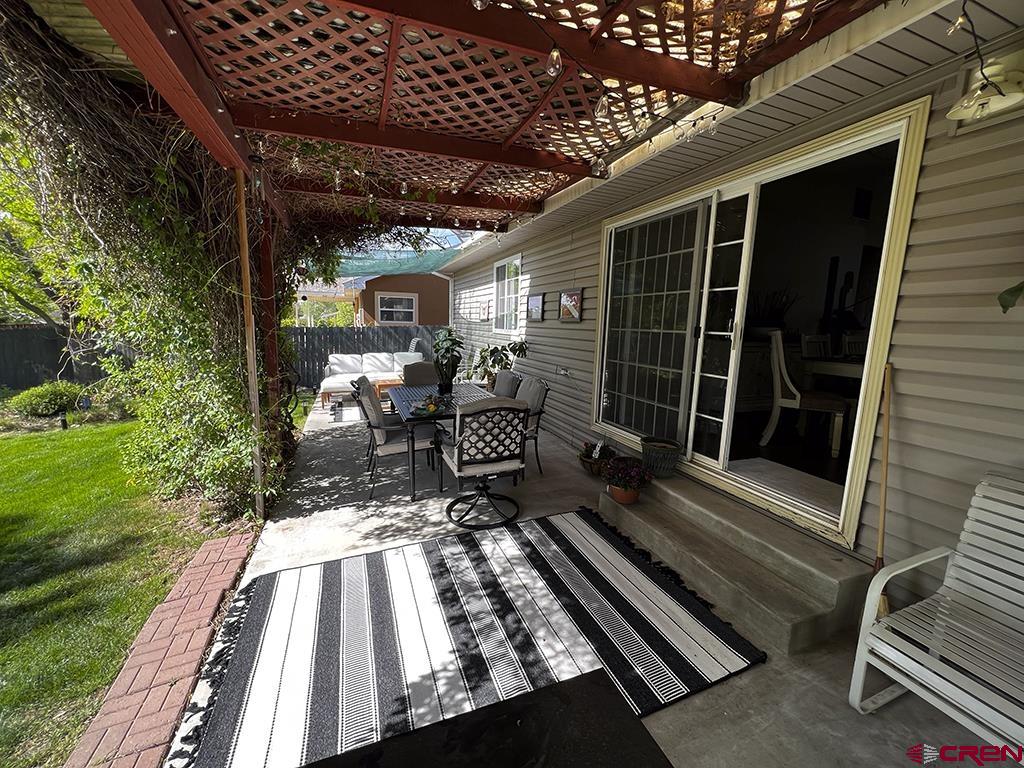 407 Colorado Street Cortez, CO 81321 - Photo 34 of 35 a view of deck with wooden floor and outdoor seating