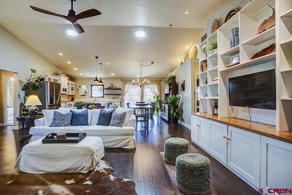 407 Colorado Street Cortez, CO 81321 - Photo 6 of 35 a living room with furniture kitchen view and a flat screen tv