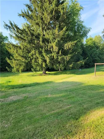 a view of a swimming pool with an outdoor space and seating area